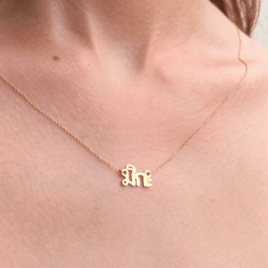 Mika name necklace being worn
